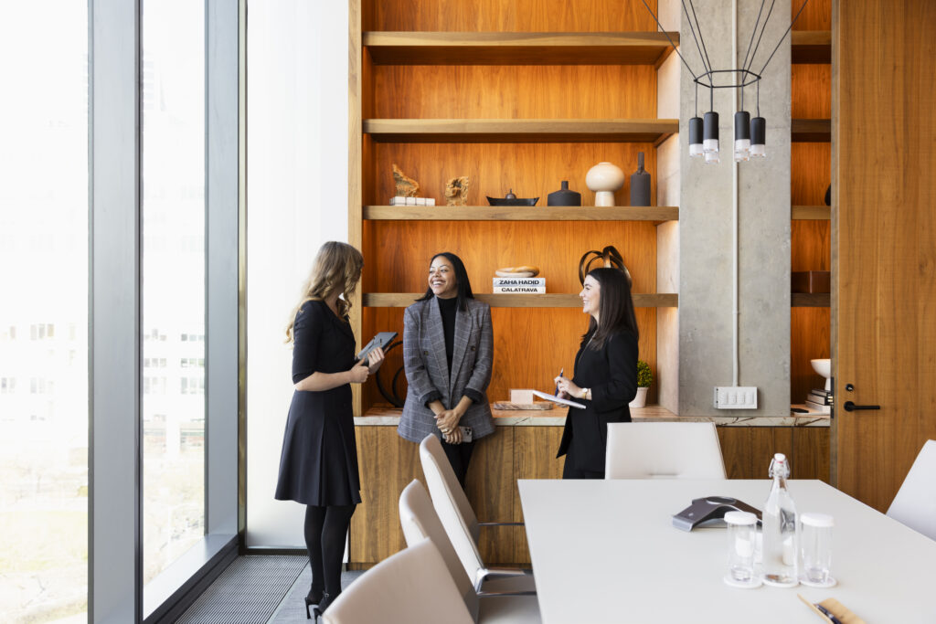 women gathering in board room and having an discussion