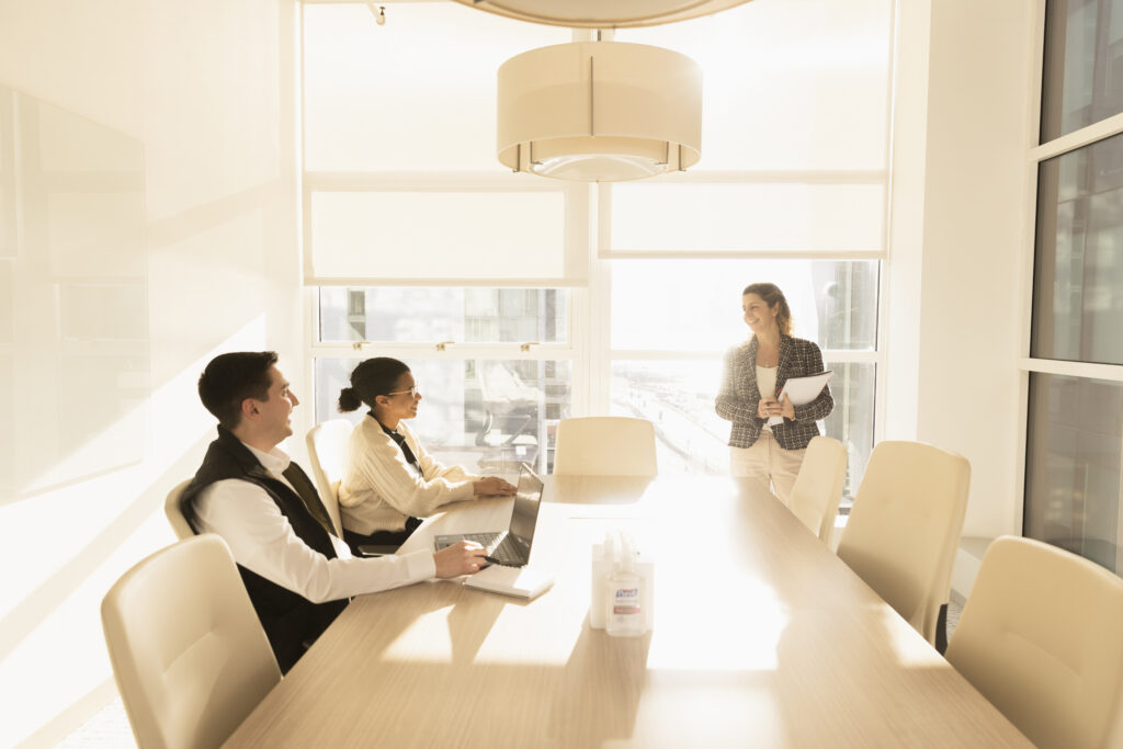 people gathering in board room and having a discussion